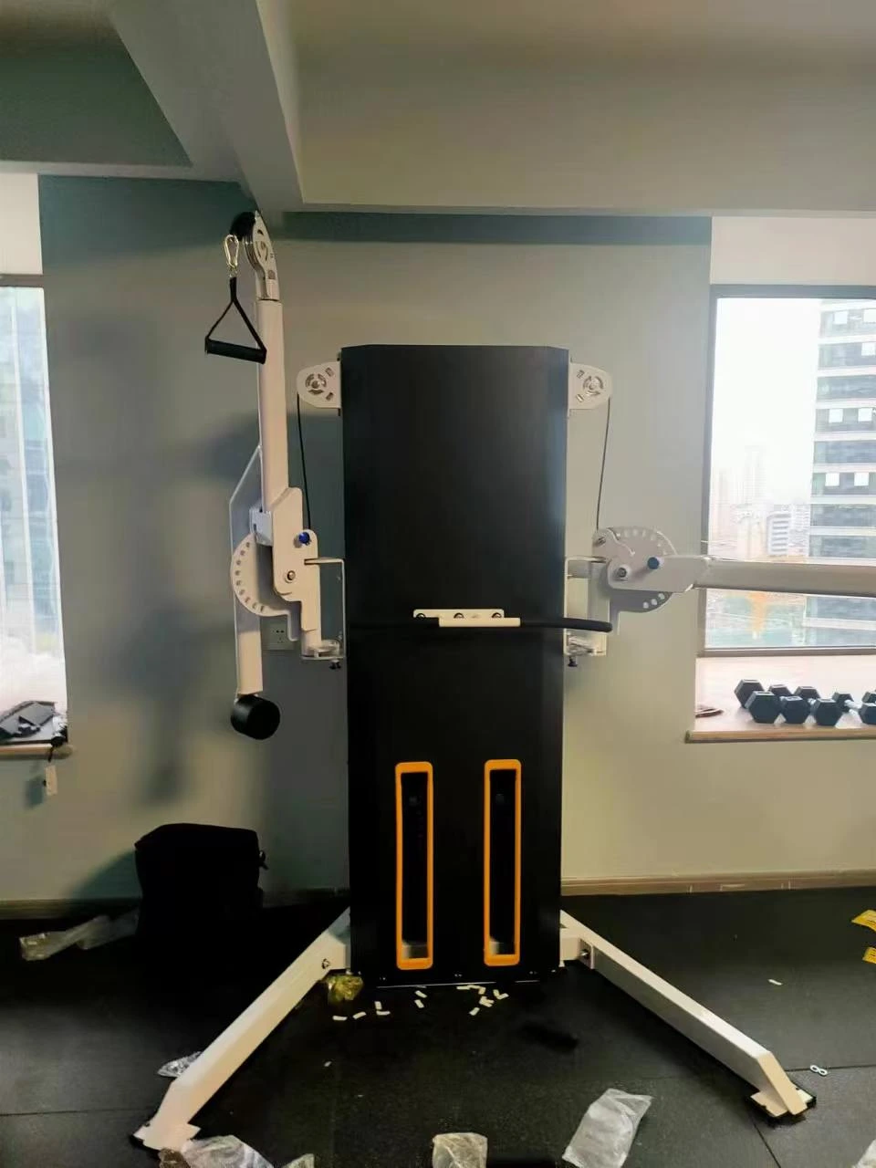 White dual cable trainer installed in a compact training room