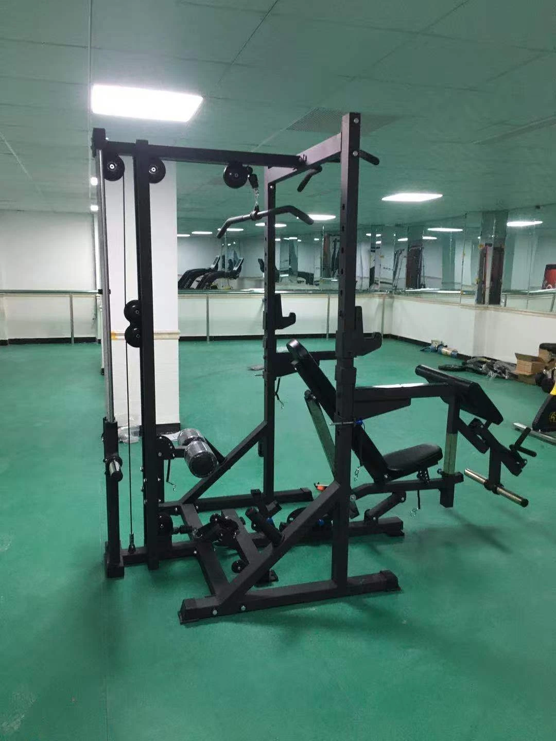 Side view of the multi-gym cable and bench configuration