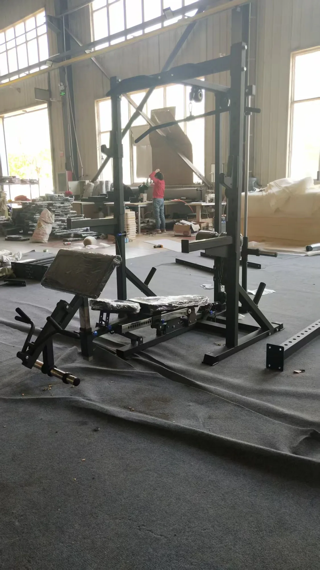 Multi-gym frame and removable bench during workshop assembly